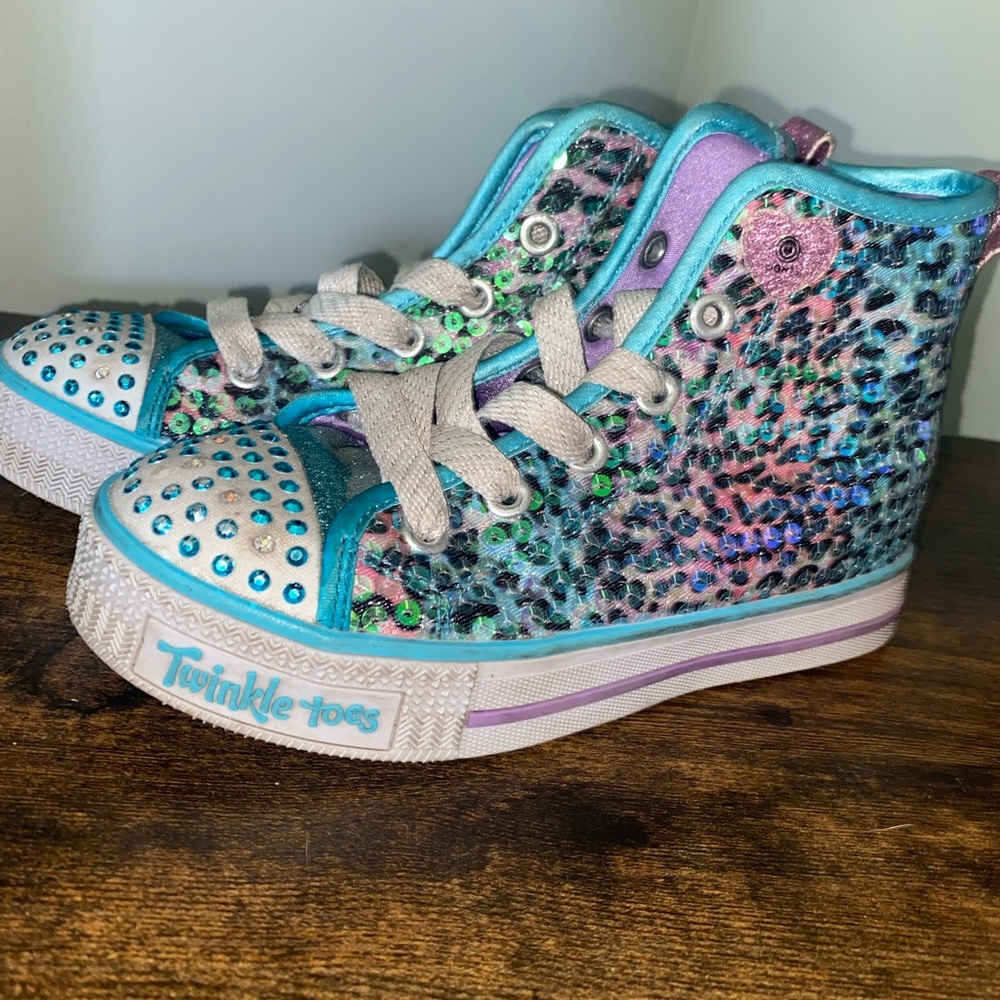 Sketchers little girls size 12. Still in good shape. Throw offers my way.